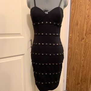 Sexy lil’ form fitted black dress with studs